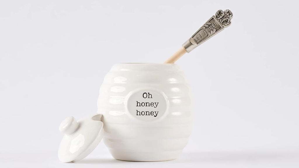Glass honey dispenser - Stylish kitchen accessory for convenient honey pouring and storage.